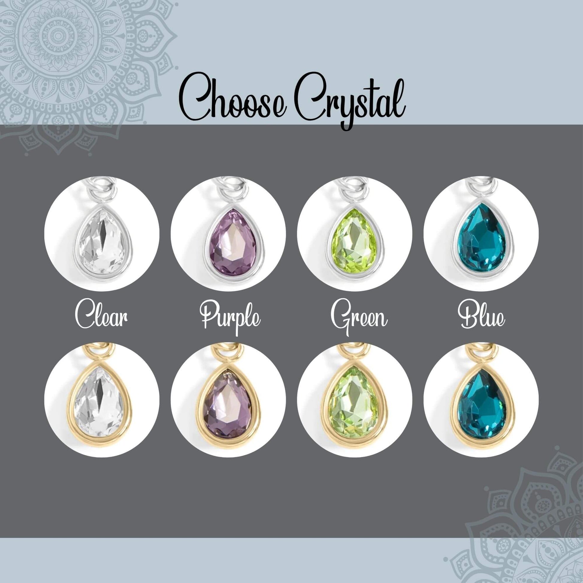 A jewelry color-options graphic titled 'Choose Crystal' showing six teardrop pendant charms in different crystal colors: Clear, Purple, Green, Blue, Clear with gold, and Purple with gold. Each pendant is displayed inside a white oval on a dark gray background with a light blue border.